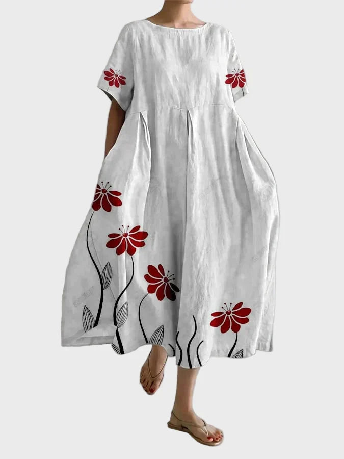 Rosa Kleid mit roten Blütenranken